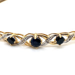 9CT YELLOW GOLD SAPPHIRES & DIAMONDS SET IN HINGED BANGLE