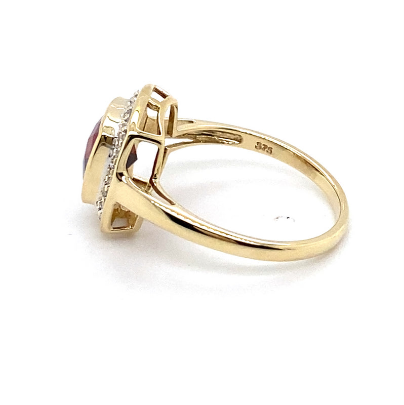 9CT YELLOW GOLD GARNET BEZEL SET SURROUNDED BY DIAMONDS DRESS RING