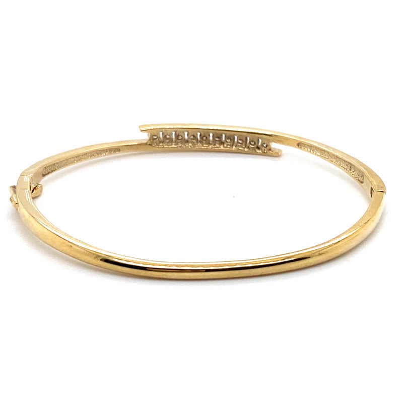 9CT YELLOW GOLD HINGED OVAL CROSS OVER PATTERNED BANGLE VALUED @ $3498