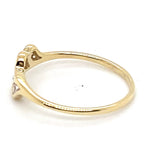 9CT YELLOW GOLD CUBIC ZIRCONIAS CHANNEL SET IN THE CROSS OVER RING