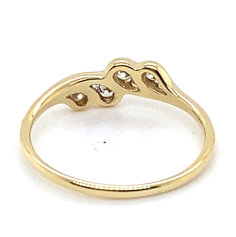 9CT YELLOW GOLD CUBIC ZIRCONIAS CHANNEL SET IN THE CROSS OVER RING