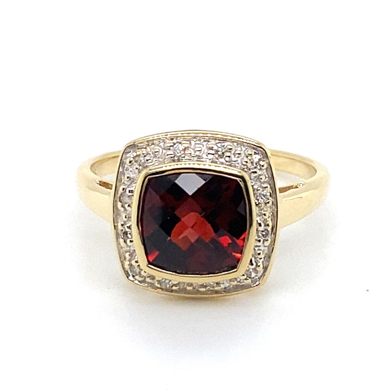 9CT YELLOW GOLD GARNET BEZEL SET SURROUNDED BY DIAMONDS DRESS RING