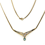 9CT YELLOW GOLD FLAT DOUBLE CURB CHAIN WITH DIAMOND & TOPAZ IN "V" SHAPE