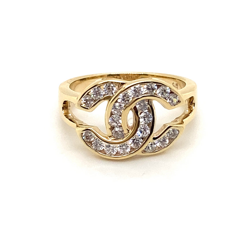 9CT YELLOW GOLD CUBIC ZIRCONIAS SET IN CROSS OVER C PATTERN RING