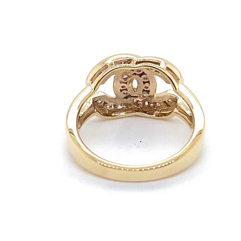 9CT YELLOW GOLD CUBIC ZIRCONIAS SET IN CROSS OVER C PATTERN RING