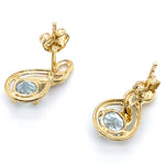 9CT YELLOW GOLD AQUAMARINE & DIAMONDS SET IN CROSSOVER STYLE STUD EARRINGS