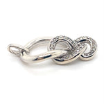 DIAMONDS SET IN IN SILVER KNOT STYLE PENDANT