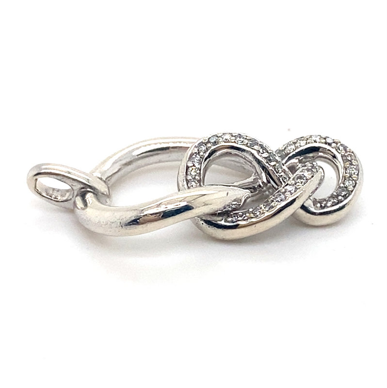 DIAMONDS SET IN IN SILVER KNOT STYLE PENDANT