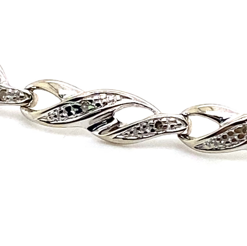 9CT WHITE GOLD DIAMONDS SET IN CROSS OVER LINKS 16CM BRACELET