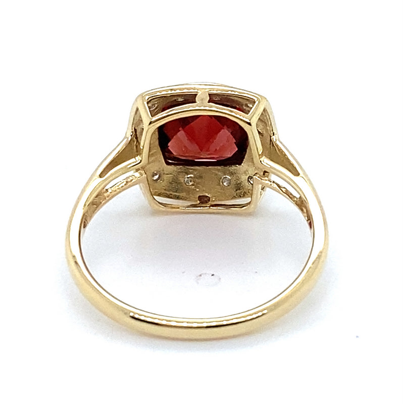 9CT YELLOW GOLD GARNET BEZEL SET SURROUNDED BY DIAMONDS DRESS RING