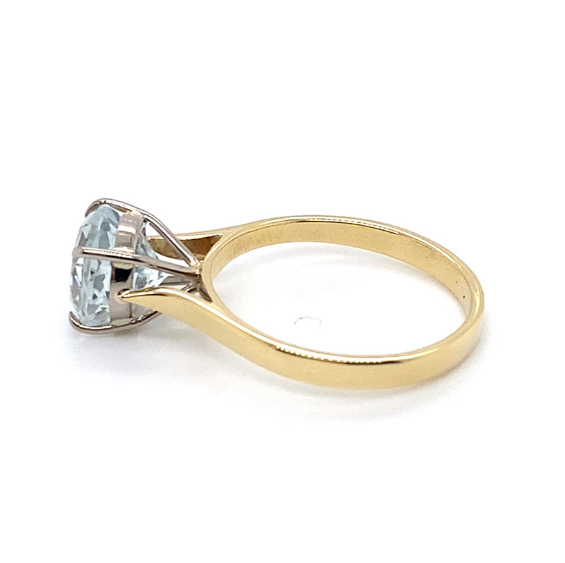 9CT YELLOW & WHITE GOLD TOPAZ SET IN RAISED SETTING DRESS RING