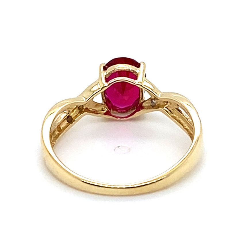 9CT YELLOW GOLD SYNTHETIC RUBY & DIAMONDS SET IN CROSSOVER PATTERN RING