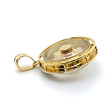 18CT YELLOW GOLD DIAMONDS SET IN ROUND PENDANT WITH ENCASED SPINNER ELEPHANT