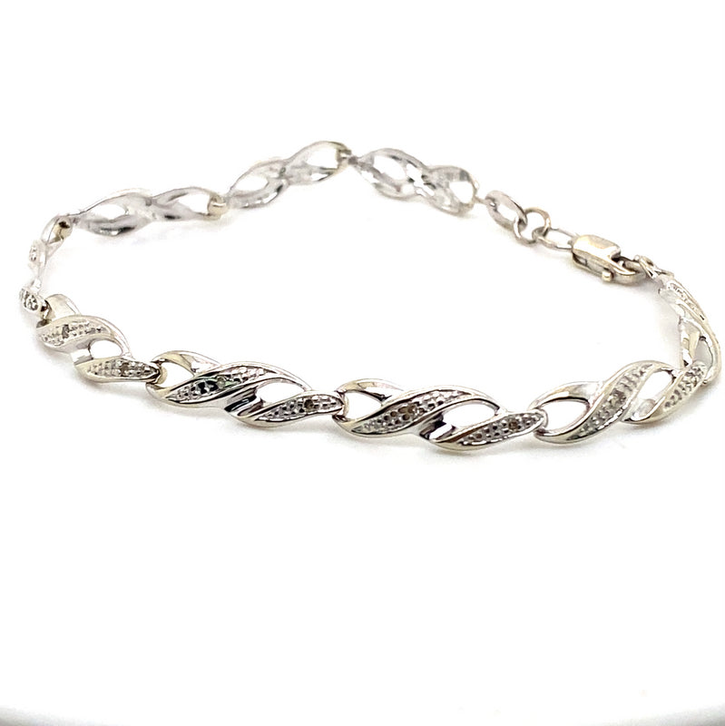 9CT WHITE GOLD DIAMONDS SET IN CROSS OVER LINKS 16CM BRACELET