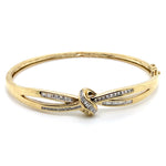 9CT YELLOW GOLD DIAMOND CROSSOVER PATTERN HINGED BANGLE VALUED @ $3499