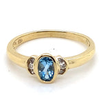 9CT YELLOW GOLD BEZEL SET TOPAZ AND DIAMOND DRESS RING