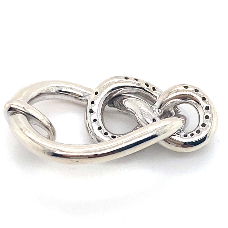 DIAMONDS SET IN IN SILVER KNOT STYLE PENDANT