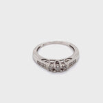 9CT WHITE GOLD TILOGY STYLE SETTING DIAMOND DRESS RING VALUED @ $950